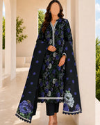 Woman wearing a floral dress with a matching long coat in an outdoor setting