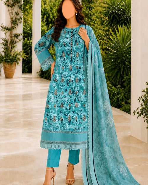 Woman wearing a turquoise embroidered outfit with a matching dupatta in an outdoor setting.