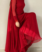 Close-up of embellished cuffs on a red chiffon Pakistani outfit.