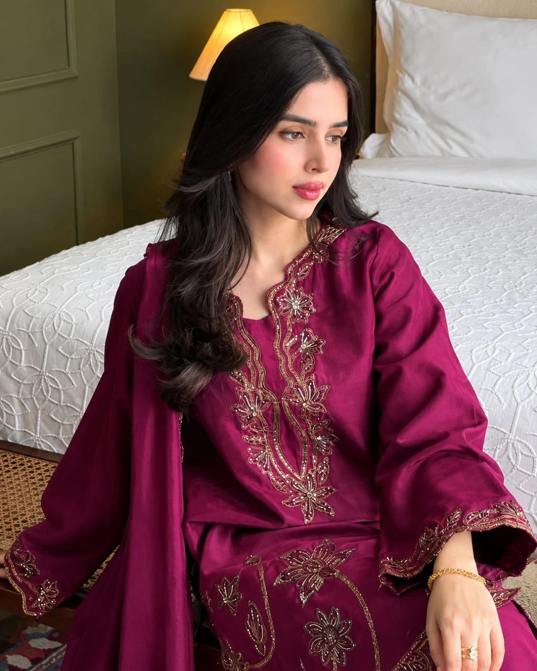 Luxury magenta embroidered Pakistani dress with golden detailing and matching chiffon dupatta.