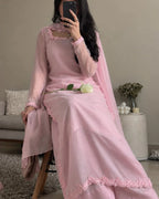 Pastel pink shirt featuring delicate floral lace on the neckline and sleeves.