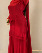 Red chiffon shirt featuring delicate detailing around the neckline.