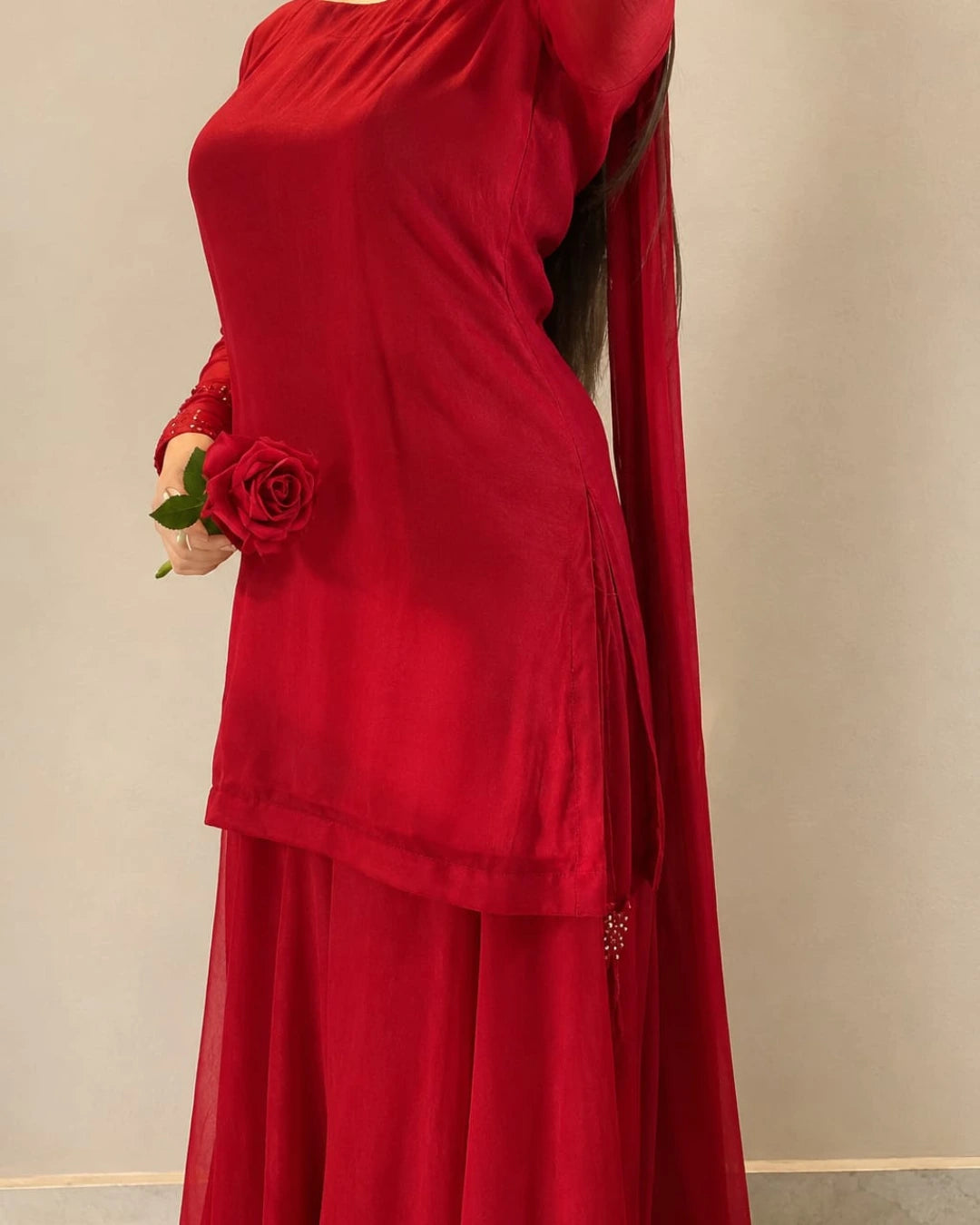 Red chiffon shirt featuring delicate detailing around the neckline.