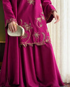 Women's plum Tussil Silk formal suit with embroidered neckline, sleeves, and plazo trousers.