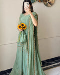 Timeless QAM Style festive fashion featuring a sage green embroidered ensemble, luxurious-looking fabric, intricate golden accents, and a beautifully draped chiffon dupatta.