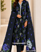 Woman wearing a floral dress with a matching dupatta in a neutral setting