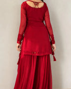 Deep red Pakistani shirt with embellished neckline and 34-inch length.