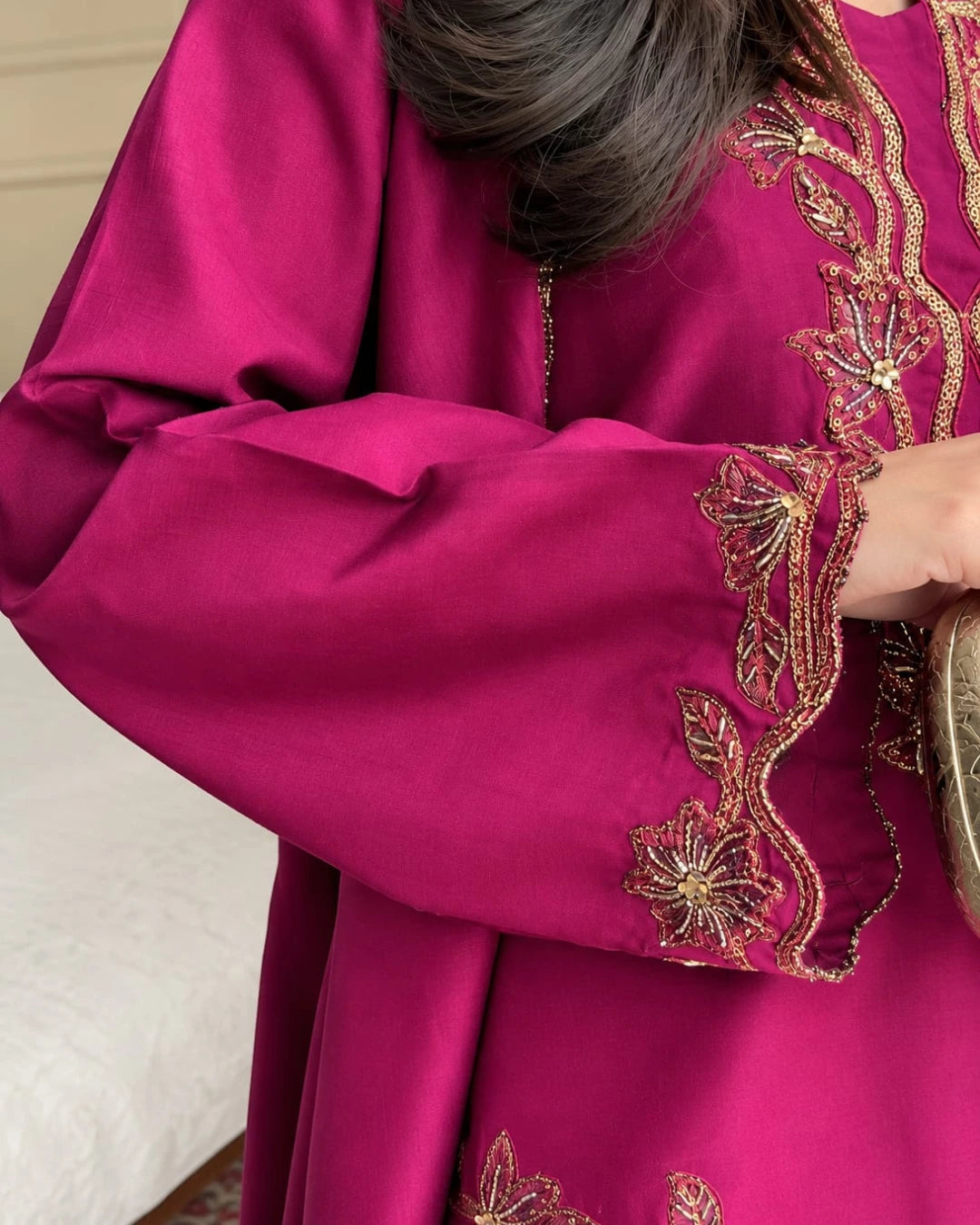 1. Pakistani women's formal wear featuring a plum embroidered shirt, chiffon dupatta, and plazo-style trousers.