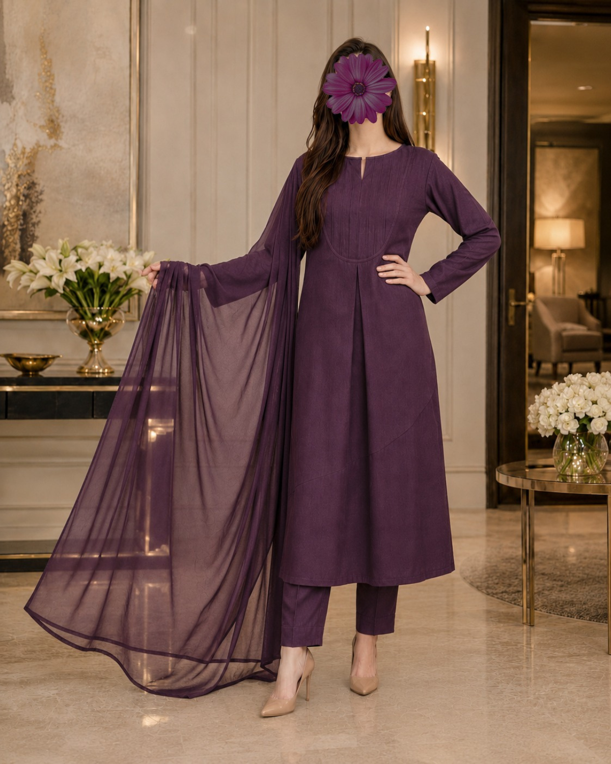 A woman models a deep purple traditional South Asian outfit consisting of a long-sleeved kurta, matching trousers, and a sheer dupatta, set against an elegant indoor background.